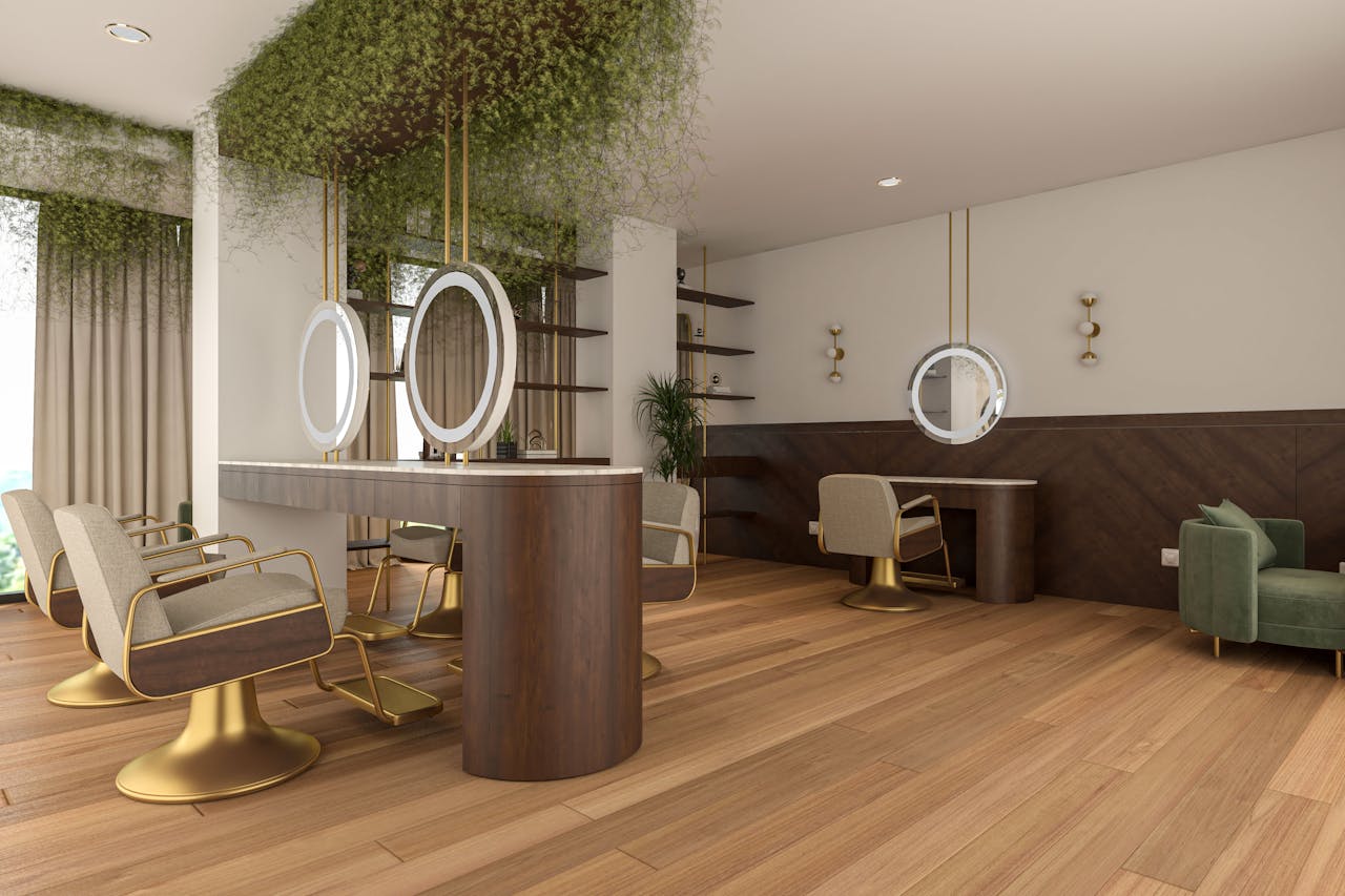 A spacious and stylish hair salon interior featuring elegant furniture and greenery.